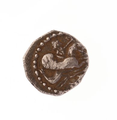 l'image d'une pièce de monnaie représentant un cheval, sur un fond blanc