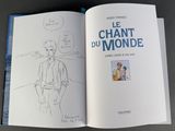 an open book with a drawing of a man in a suit and tie