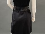 an image of a mannequin wearing a black dress on a mannequin
