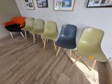 five chairs lined up in a row in a room