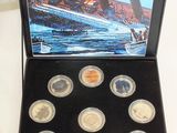 a box of coins with a picture of a ship on it