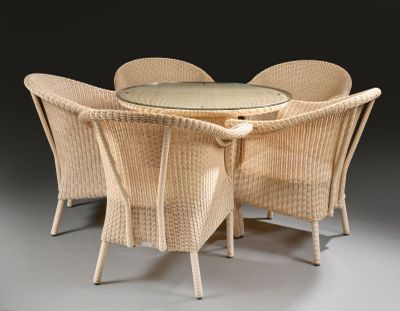a table with four chairs around it and a glass top