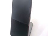 a phone that is sitting on top of a stand