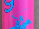 a pink bottle with a blue lid sitting on a tiled floor