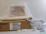 a box with a roll of fabric and a bowl on the table