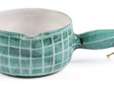 a green cup with a handle on a white background