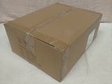 a box that is sitting on a bed with a white sheet