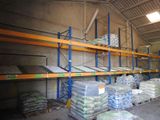 a large amount of bags of cement on the shelves