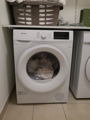a washer and a dryer in a small room