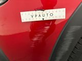a close up of a sticker on the hood of a red car
