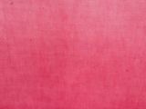 a close up of a pink fabric background with a very soft feel