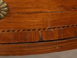 a close up of a wooden table with a flower on it