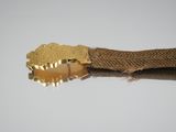 a close up of a gold belt with a gold buckle on it