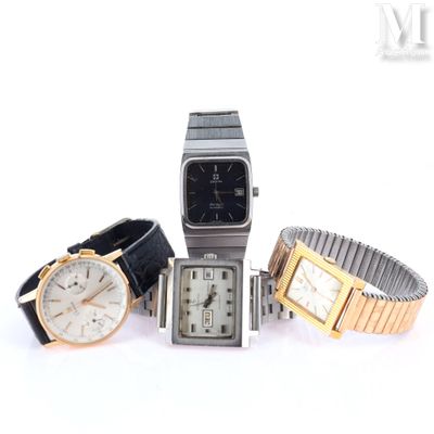 three watches are sitting next to each other on a white surface
