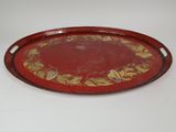 a red and gold tray with a floral design on it