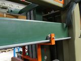 an image of a machine that is working on a piece of wood