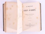an open book on a white surface with a white background