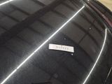 a sticker on the hood of a black car