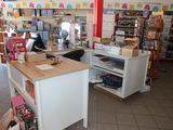 a small counter in a store with a lot of toys