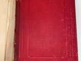 a red book open on a white table