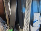 several pieces of metal are stacked on top of each other in a room