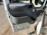 a door of a car that is open on the side of the road