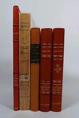 books are lined up in a row on a white surface