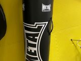 the punching bag is hanging on the wall in the gym