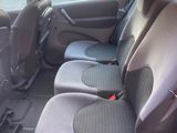 the interior of a small car with two rows of seats in it