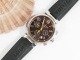 a watch that is sitting on a table next to a shell