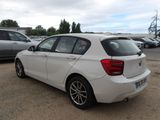 a white car parked in a parking lot with other cars in the background