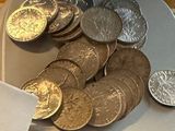 a plate of coins sitting on a table next to a napkin