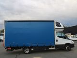 a blue box truck parked in a parking lot