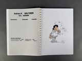 a book with a drawing of a boy holding a baseball bat