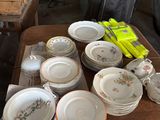a table that has many plates and bowls on it