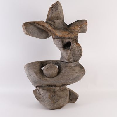 an image of a wooden sculpture with a bird on top of it