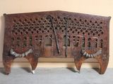 a wooden bench that has been carved into the wall