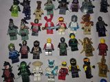 a lot of lego minifigurs that are on a table