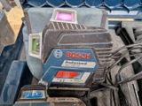 a bosch power drill and other tools in a toolbox