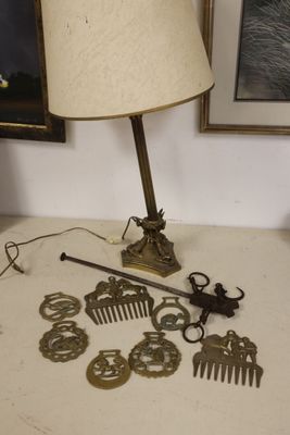 a table with a lamp and a bunch of hair accessories on it