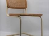 an image of a chair with a wicker back and seat