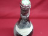 a bottle of wine that is sitting on a table