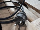 a black hose on a wooden table next to a black hose
