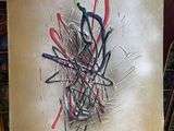 a painting on a easel with a lot of paint on it