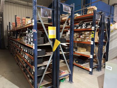 a large rack with many items on it in a warehouse