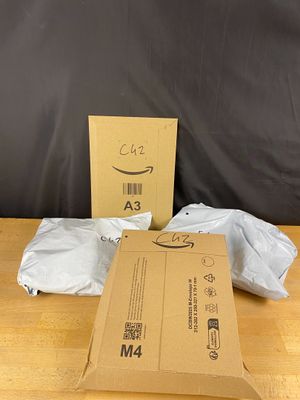 a cardboard box and a package on a wooden table