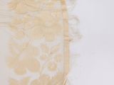 a pair of scissors and a piece of fabric on a table