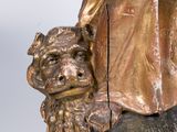 bronze statue of a man and a woman with a dog