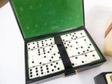 a box of dominos sitting on a table next to a cell phone
