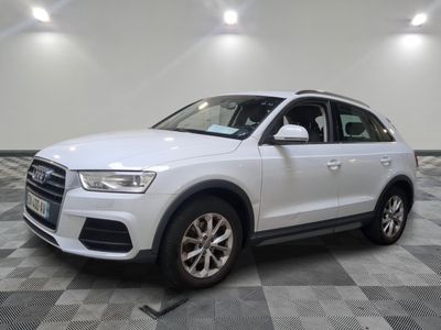 the white audi suv is parked on a checkered tile floor
